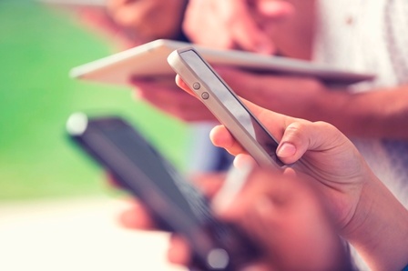 Group of people using mobile devices